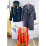 A Russian artillery uniform comprising Jacket, Trousers and cap with an air force Greatcoat and a