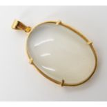 A bright yellow metal moonstone set pendant dimensions 4.5cm x 2.4cm, weight 15.6gms Condition