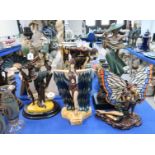Four Art Deco style resin figures and lamps and another figure Condition Report: Available upon
