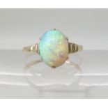 A yellow metal opal Art Deco ring size of opal approx 9.1mm x 7.4mm, size K, weight 1.7gms Condition