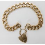 A 9ct gold curb link bracelet with heart shaped clasp, length 21cm, weight 34.9gms Condition Report:
