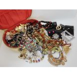A box full of vintage beads, brooches etc Condition Report: No condition report available for this