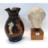 A copy of a 4th Century wine jug and a plaster classical head Condition Report: Available upon