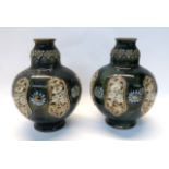 A pair of Doulton Lambeth vases with relief decoration of daisies Condition Report: Available upon