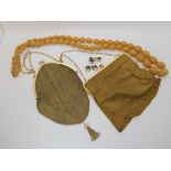 Two gold plated handbags, with blue glass acorn clasps, a string of celluloid beads and a pair of