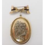 A silver locket brooch depicting a bird Condition Report: No condition report available for this