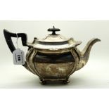 A silver teapot, Sheffield 1919, of rounded rectangular form and four ball feet, 16cm high, 704gms