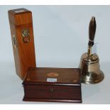 A brass hand bell, cigarette box, and candle box Condition Report: Available upon request