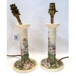 A pair of Moorcroft apple blossom pattern candlestick table lamps Condition Report: Crazing to both