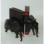 A pair of carved elephant bookends and an Art Deco style wall barometer Condition Report: