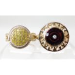 A 9ct gold ring set with a Glen Lehrer torus cut garnet with a central diamond size O, weight 5.