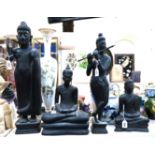 *WITHDRAWN* Four carved black wood figures of Buddha's Condition Report: Available upon request