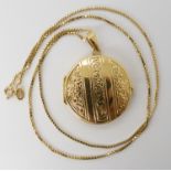 An 18ct gold locket diameter 3.1cm, with an 18ct box chain length 50cm, combined weight 19.8gms