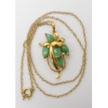 A bright yellow metal Chinese green hardstone pendant, length 3.8cm together with a 9ct chain length