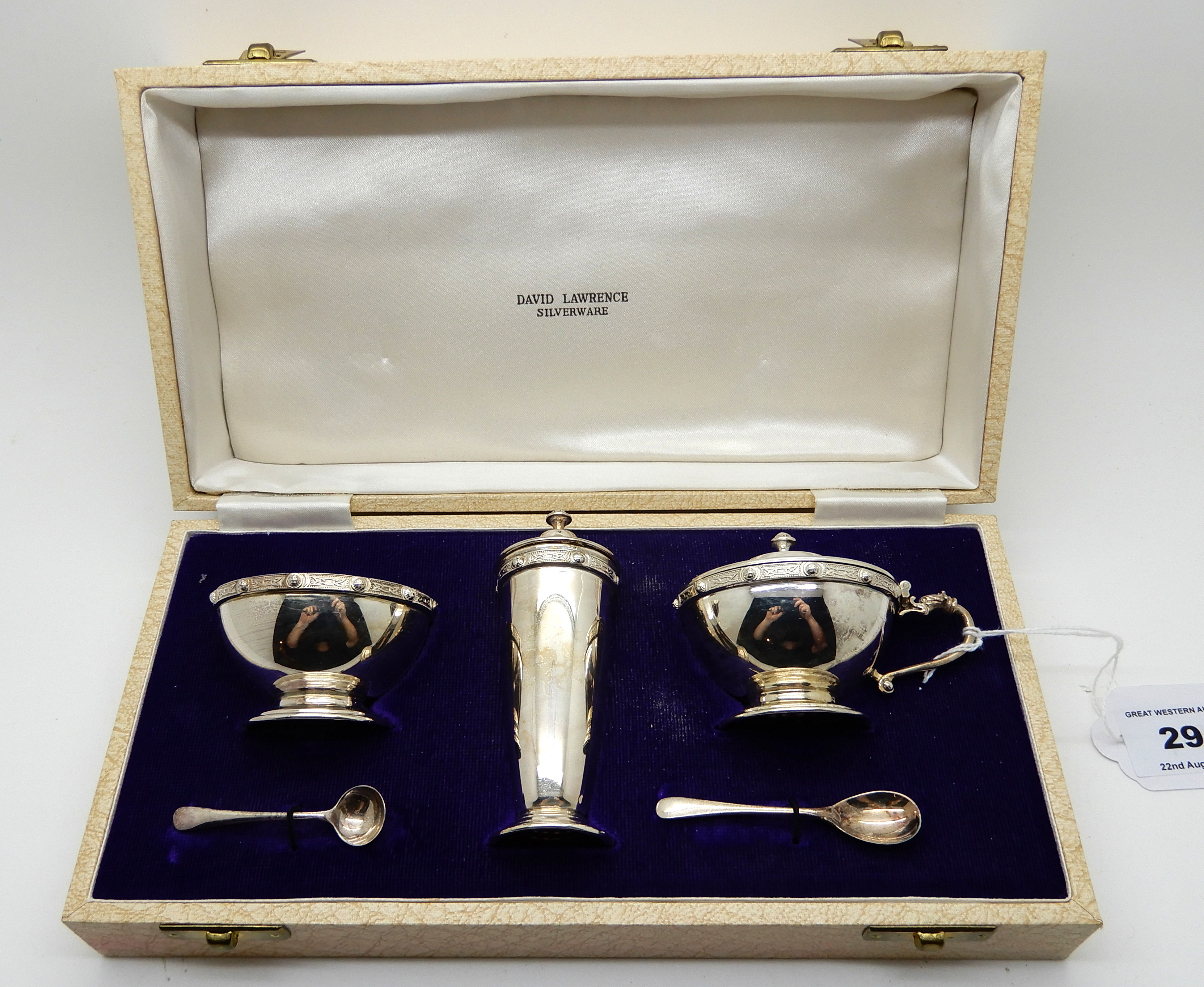 A cased three piece silver condiment set with Celtic decoration, Birmingham 1967 Condition Report: