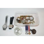 A collection of military badges, gents watches etc Condition Report: Available upon request
