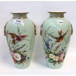 A pair of hard paste porcelain vases painted with birds and foliage, 26cm high Condition Report: