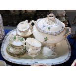 A large ceramic platter with double headed dragon motif, with matching soup tureen, cups and saucers