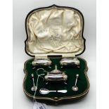 A cased three piece silver condiment set, Birmingham 1910 Condition Report: Available upon request