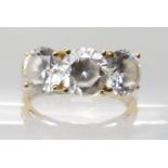 A 14k gold three clear gem set ring, finger size M1/2 Condition Report: Available upon request
