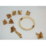 A carved ivory bangle and carved netsukes Condition Report: Available upon request