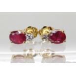 A pair of 10k gold ruby and diamond earrings, head size 7.3mm, weight 1gm Condition Report: