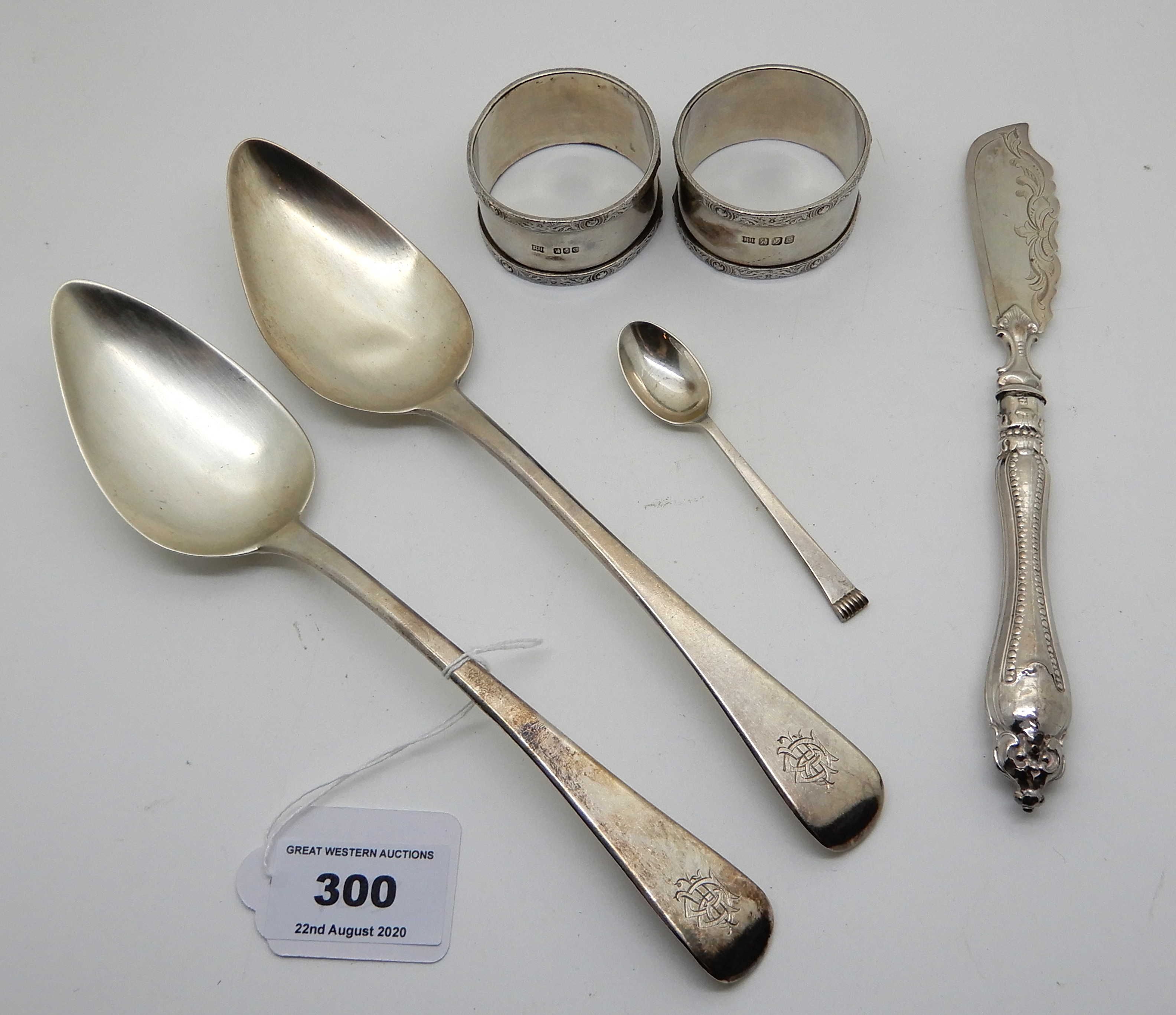 A lot comprising a pair of silver tablespoons, London 1804, a pair of silver napkin rings, a