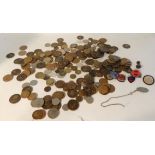 A quantity of UK coins and two enamel military badges Condition Report: Available upon request