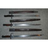 Seven various bayonets in scabbards Condition Report: Available upon request