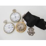 A gold plated open face Swiss pocket watch with black ribbon and silver monogram fob pendant, a