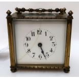 A brass and glass cased carriage clock, the movement with incised lion motif Condition Report: