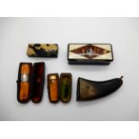 A lot comprising two cased amber cigarette holders, two snuff boxes and a pistol grip snuff box (