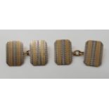 A pair of 9ct gold striped, engine turned engraved cufflinks, head size 1.6cm x 1.1cm, weight 6.5gms