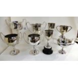 A lot comprising eight silver plated trophy cups, mainly 15/19 Hussars, 1934 - 57 Condition