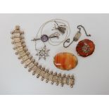 A white metal Victorian style bracelet, two Scottish carnelian brooches, a moonstone star pendant