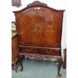 A mahogany drinks cabinet with two drawers and carved frieze, 159cm high x 100cm wide x 53cm deep
