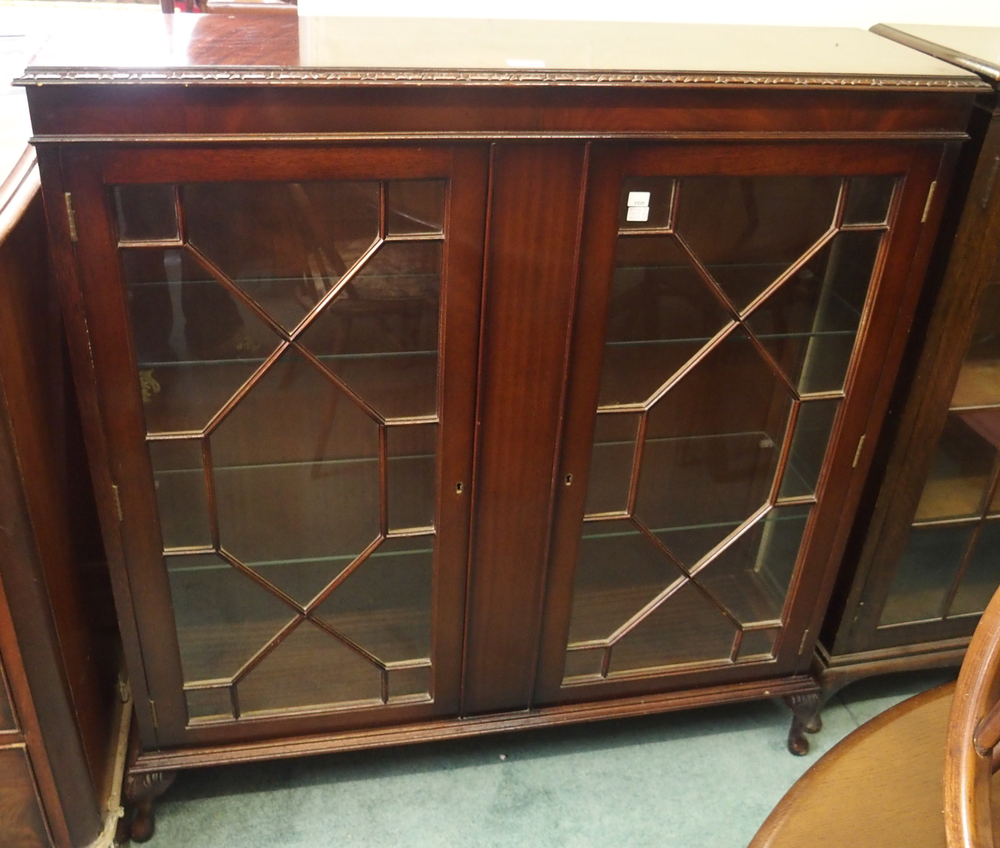 A mahogany display cabinet with astragal glazed doors, 113cm high x 110cm wide x 30cm deep Condition