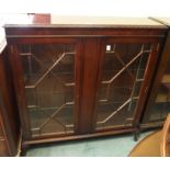A mahogany display cabinet with astragal glazed doors, 113cm high x 110cm wide x 30cm deep Condition
