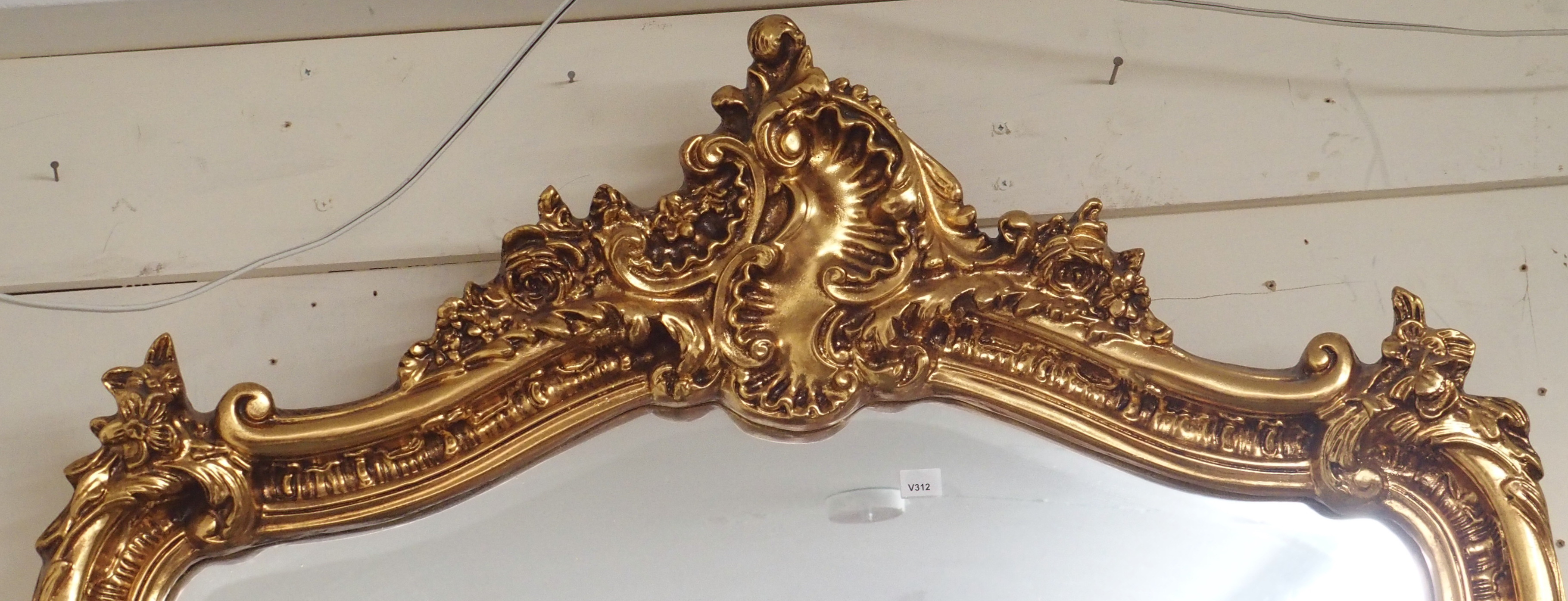 A modern ornate gilt wall mirror, 140cm high x 85cm wide Condition Report: Available upon request - Image 2 of 2