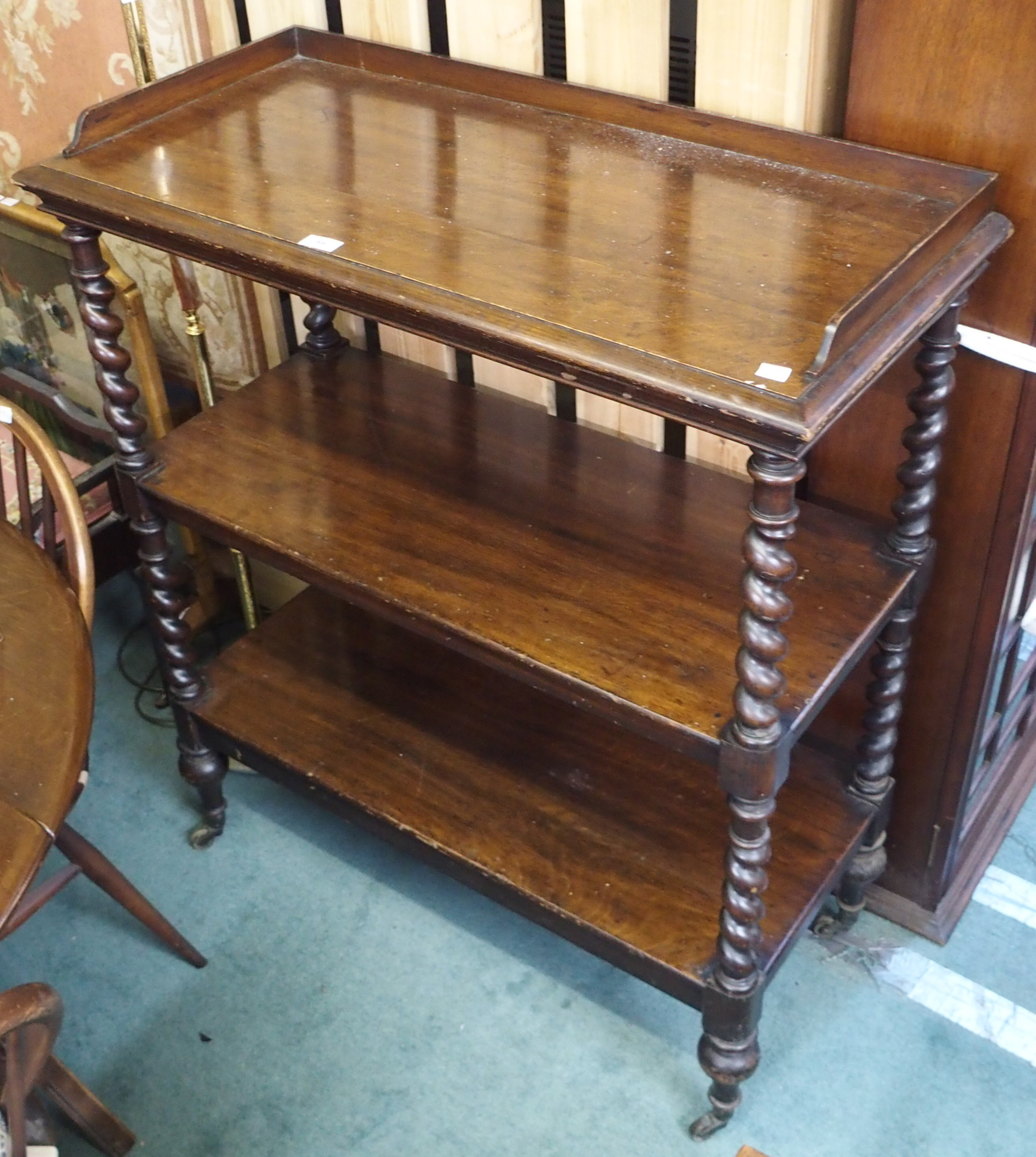 A Victorian three tier buffet with barley twist supports, 113cm high x 91cm wide x 43cm deep