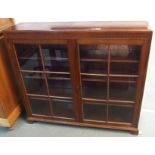 A mahogany two door glazed bookcase, 103cm high x 120cm wide x 29cm deep Condition Report: Available