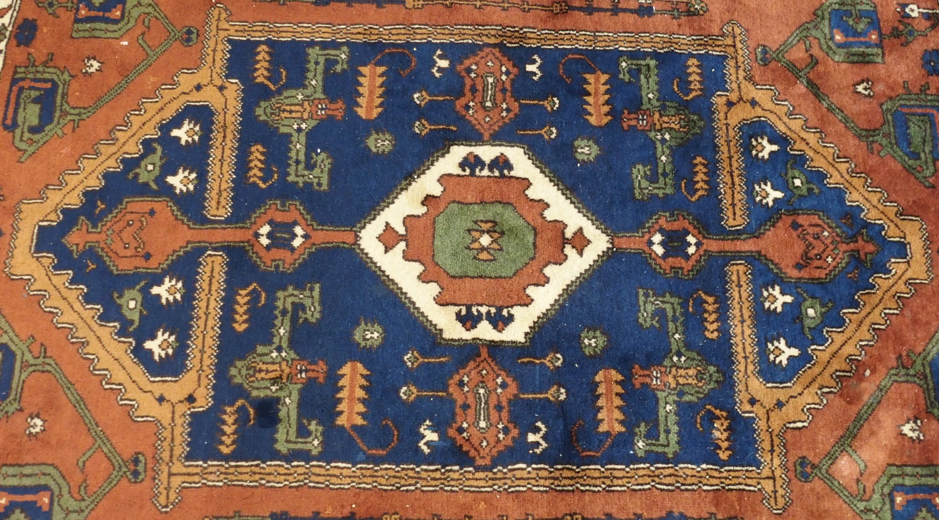 A terracotta ground Eastern rug with geometric design, 204cm x 150cm Condition Report: Available - Image 2 of 4