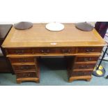A yew wood twin pedestal desk with leather skiver, 78cm high x 123cm wide x 62cm deep Condition