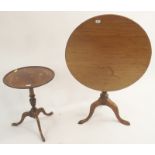 A mahogany tilt-top table on tripod base, 78cm diameter and a mahogany wine table (2) Condition