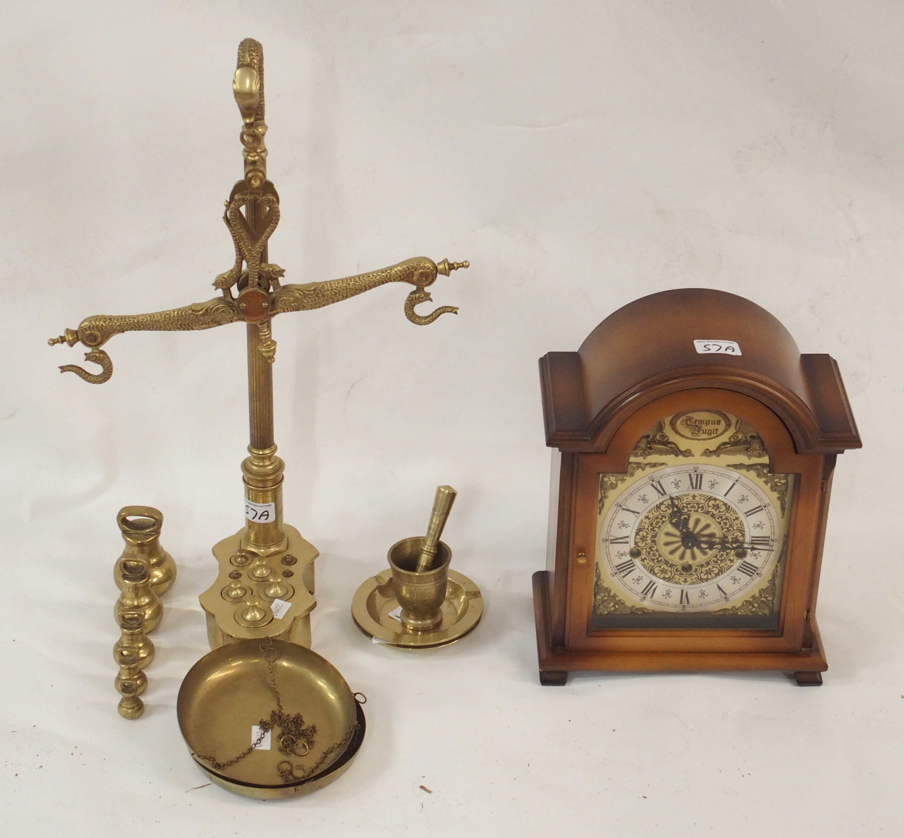 A Tempus Fugit mantle clock and a set of brass scales with weights (2) Condition Report: Available