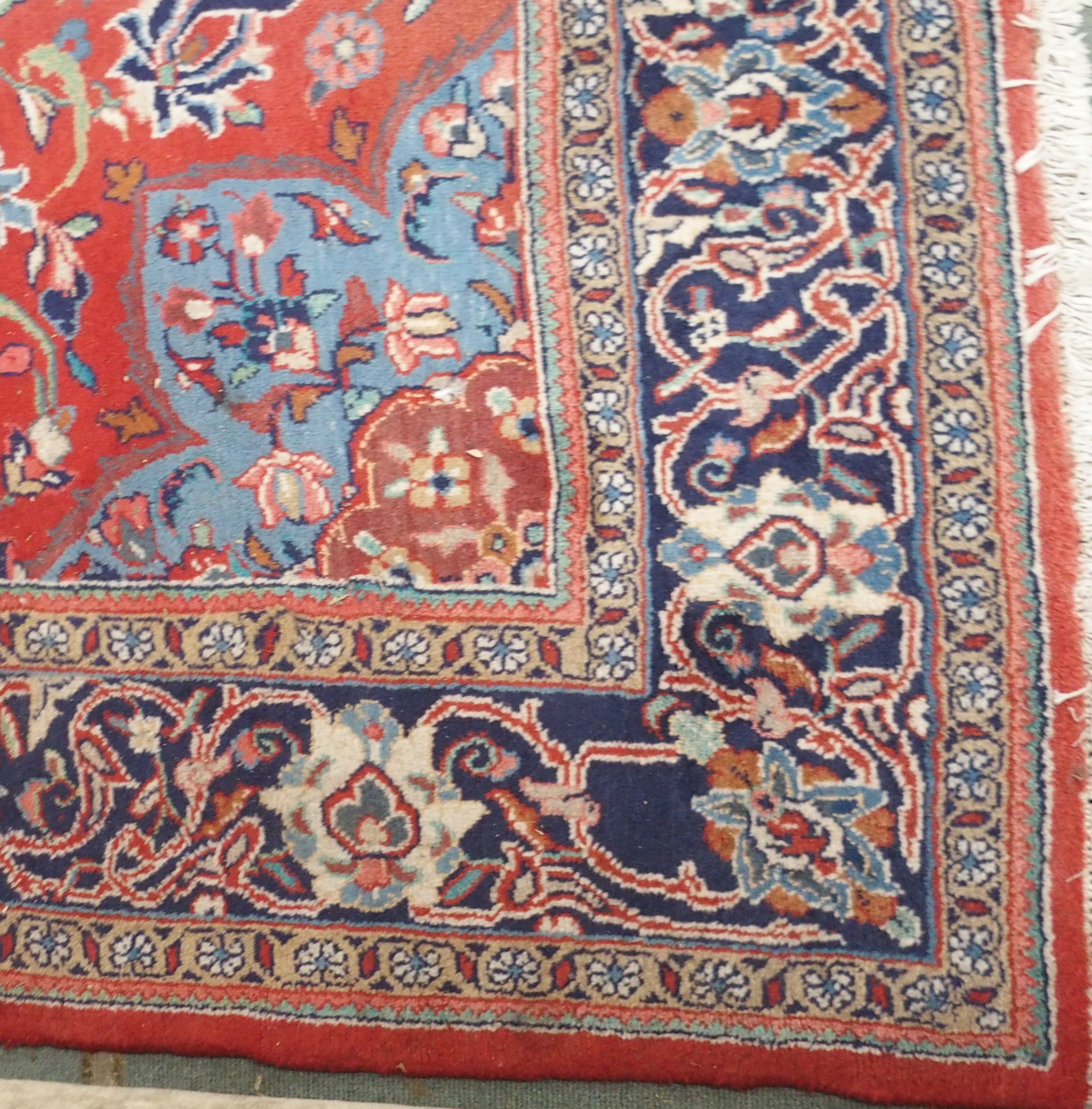 A red ground Keshan rug with blue central medallion, 342cm x 230cm Condition Report: Available - Image 4 of 5