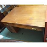 A mid-Century teak desk with frieze drawer, 79cm high x 137cm wide x 94cm deep Condition Report: