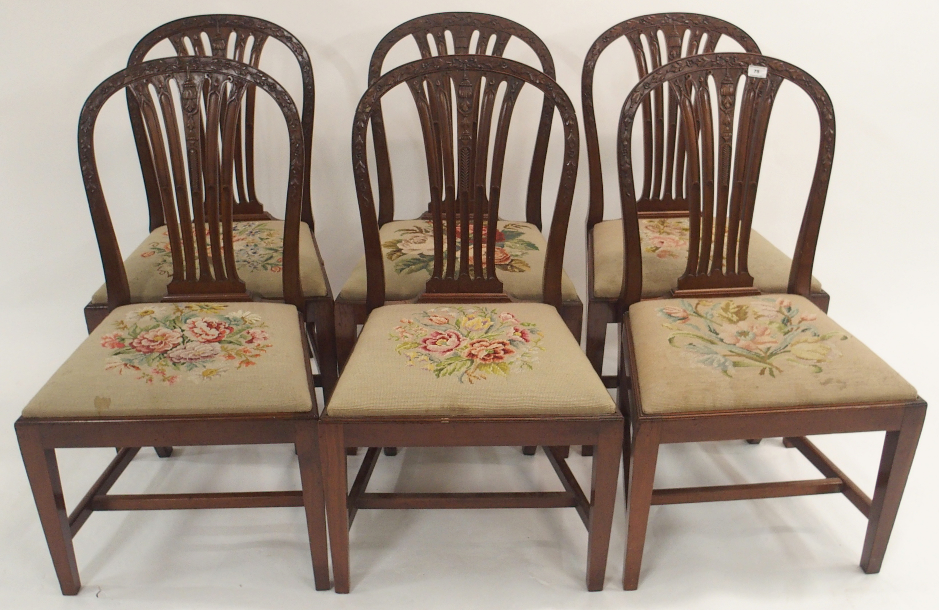 A set of six carved mahogany dining chairs with woolwork seats (John Taylor & Son, Edinburgh) (6)