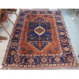 A terracotta ground Eastern rug with geometric design, 204cm x 150cm Condition Report: Available