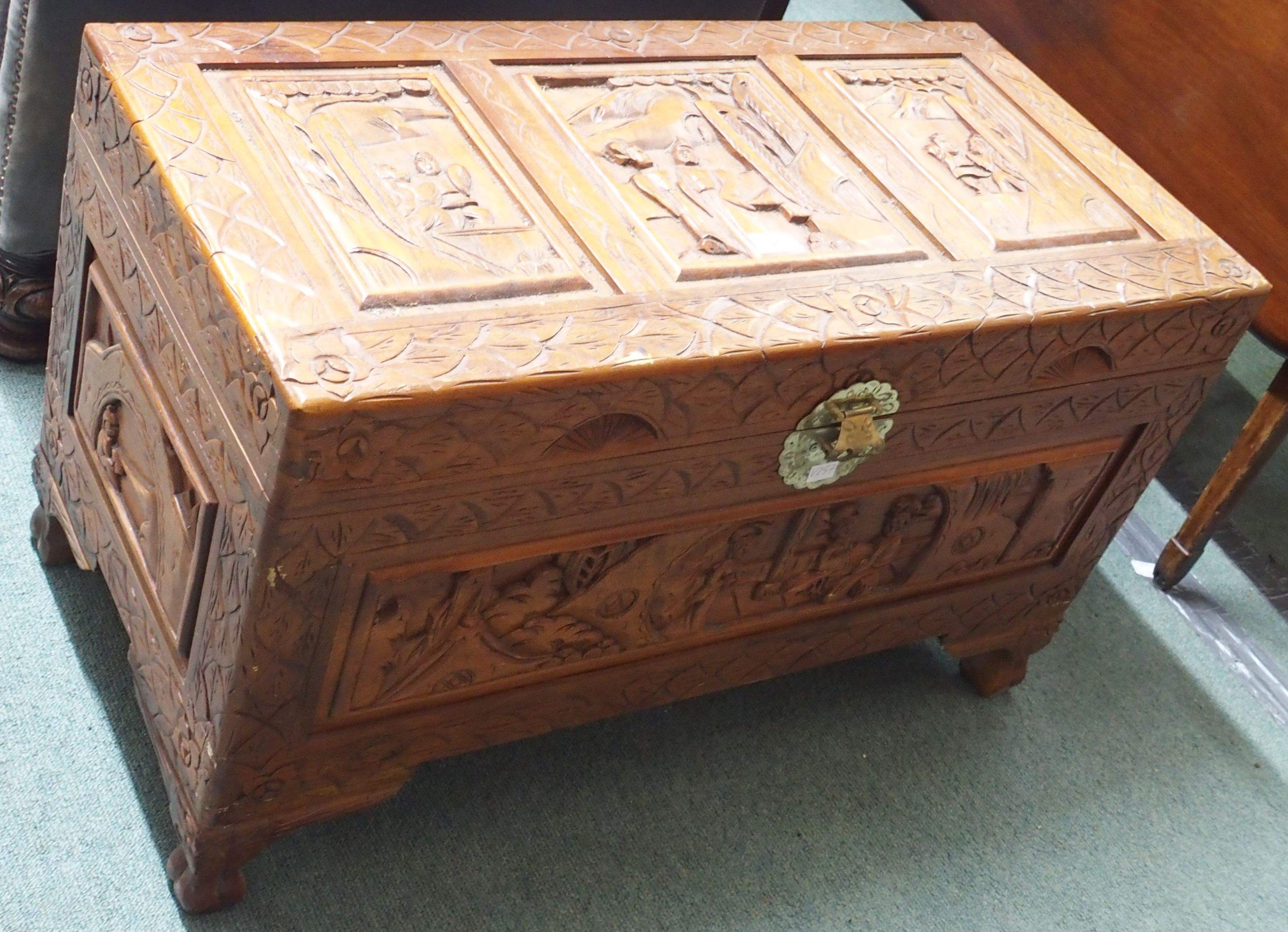 A carved camphor wood chest, 51cm high x 86cm wide x 42cm deep Condition Report: Available upon